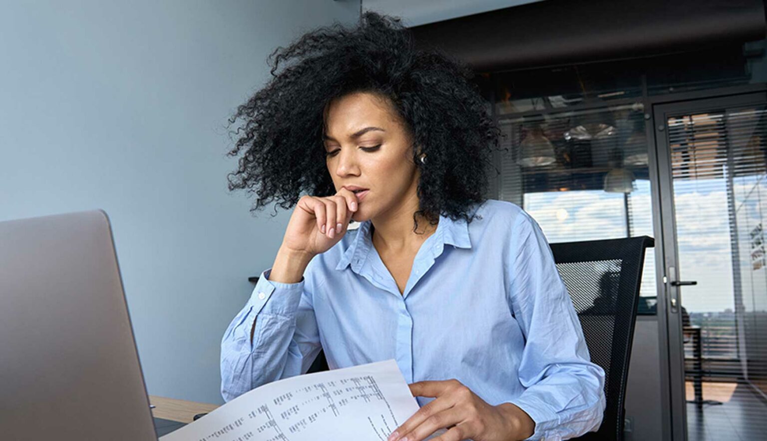 anxiious woman looking over financial documents